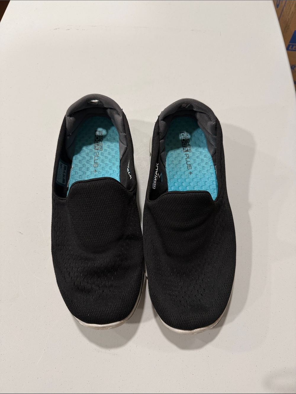 Skechers Black Slip-On Flats with Teal Insole